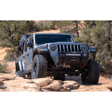 jeep gladiator bed rack with tent climbing up red rock terrain