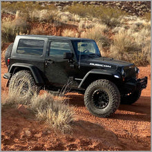 Wide fender flares on jeep rubicon in desert